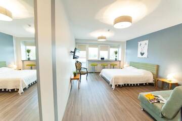 Фото номера Семейный номер с балконом Хостелы Symbiosis Hostel г. Паланга 6