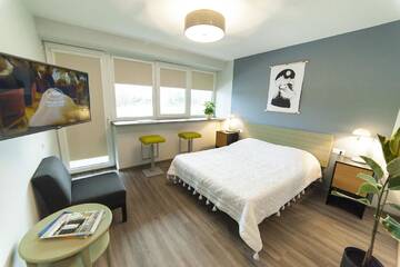 Фото номера Двухместный номер Делюкс с 1 кроватью и балконом Хостелы Symbiosis Hostel г. Паланга 4