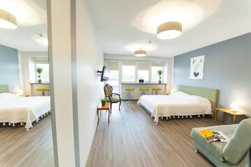Фото номера Семейный номер с балконом Хостелы Symbiosis Hostel г. Паланга 5