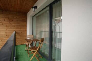 Фото номера Трехместный номер с балконом Апартаменты 365 Inn Apartments Malūno Vilos г. Паланга 20