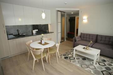 Фото номера Трехместный номер с балконом Апартаменты 365 Inn Apartments Malūno Vilos г. Паланга 25