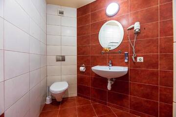 Фото номера Двухместный номер с 2 отдельными кроватями Гостевой дом Apartamentai "Tenisas" г. Паланга 7