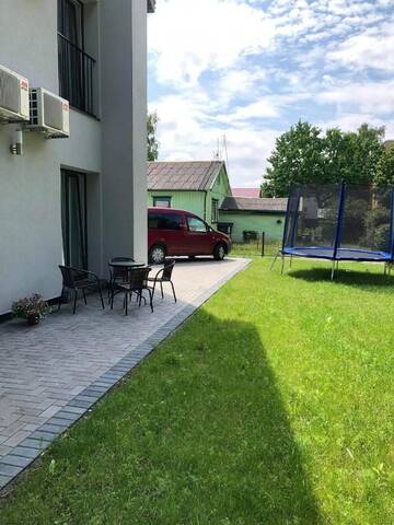 Фото номера Четырехместный номер с террасой Гостевой дом Izabelės apartamentai г. Паланга 5