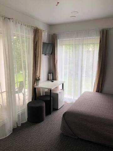 Фото номера Двухместный номер с 1 кроватью и террасой Гостевой дом Izabelės apartamentai г. Паланга 7