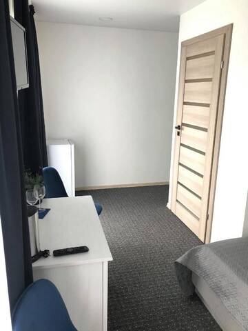 Фото номера Стандартный двухместный люкс с 1 кроватью Гостевой дом Izabelės apartamentai г. Паланга 9