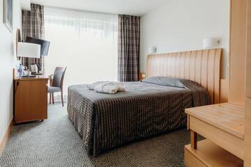Фото номера Стандартный одноместный номер с доступом в спа-центр Отель Vanagupe Spa Resort г. Паланга 3