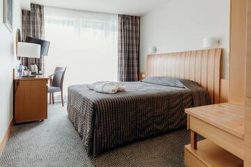 Фото номера Стандартный одноместный номер с доступом в спа-центр Отель Vanagupe Spa Resort г. Паланга 2